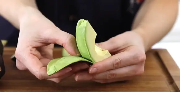 Peel off the skin from each avocado half. Peel off the skin