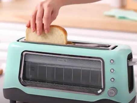 Place the bread slices in slot Place the bread slices in the toasting slot
