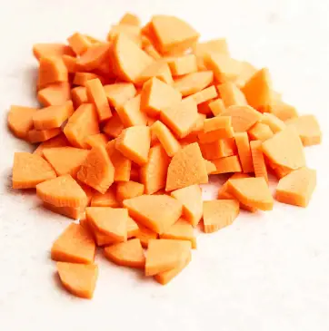 Quarter moons are made by slicing the carrot half lengthwise, then slicing each half lengthwise again Quarter Moons