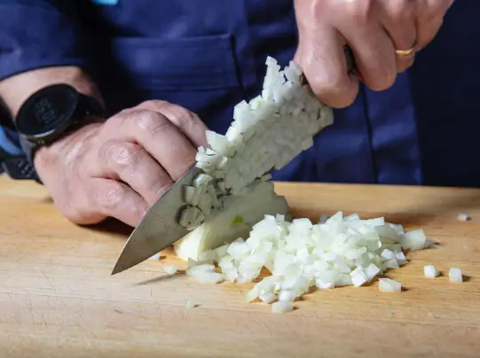 Which tool is used for dicing an onion